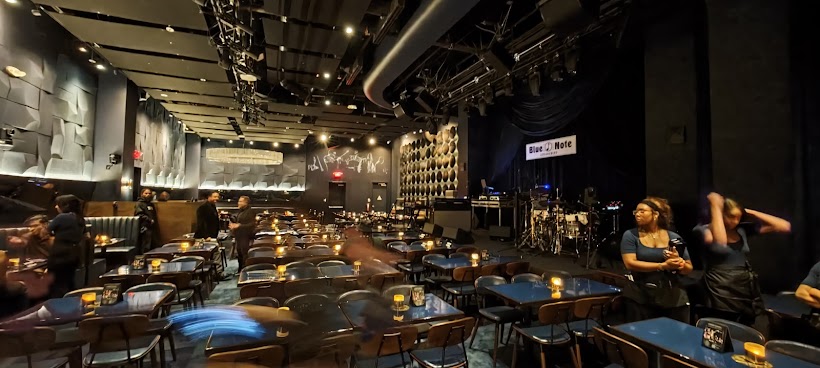 Blue Note Jazz Club listening room with candlelit tables facing the stage