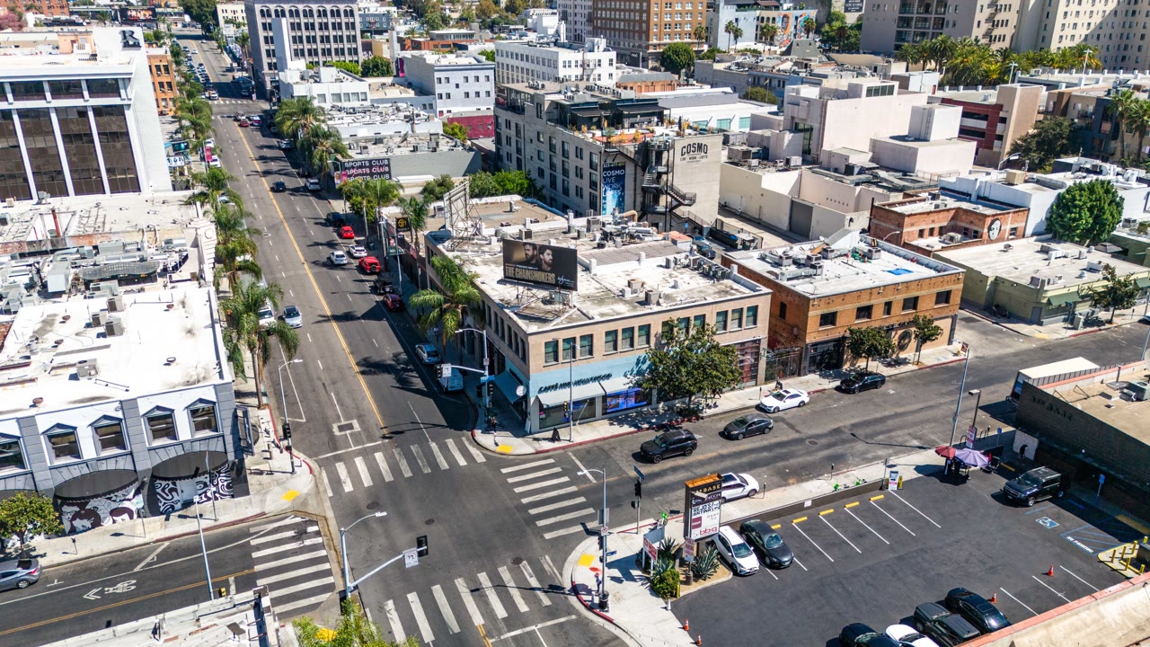Aerial approach to Cahuenga at Selma with the Hollywood Hills beyond