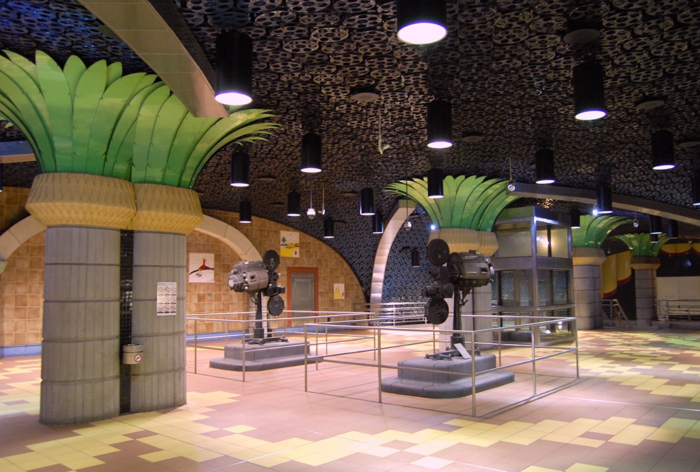 Hollywood/Vine Metro station interior with film-reel ceiling and palm-tree columns