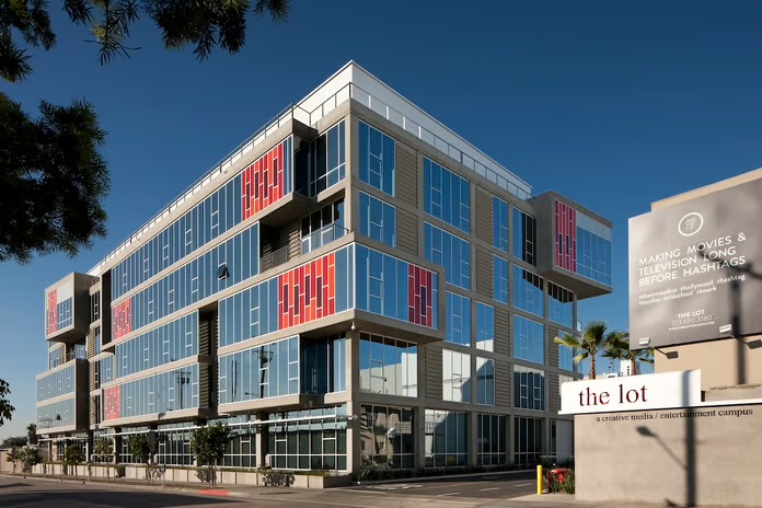The Lot at Formosa creative media campus in West Hollywood, glass office building with red accent panels