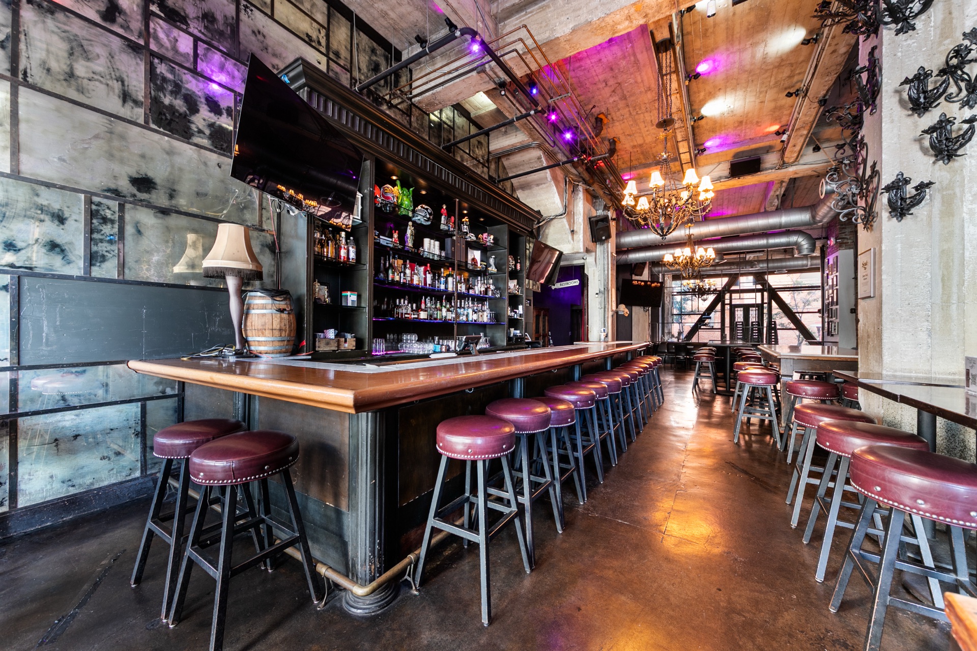 Long St. Felix bar with seating, exposed concrete ceilings and existing beverage infrastructure